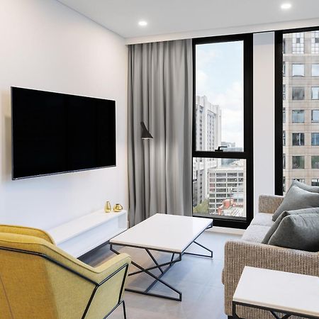 Meriton Suites Мельбурн Екстер'єр фото A living room