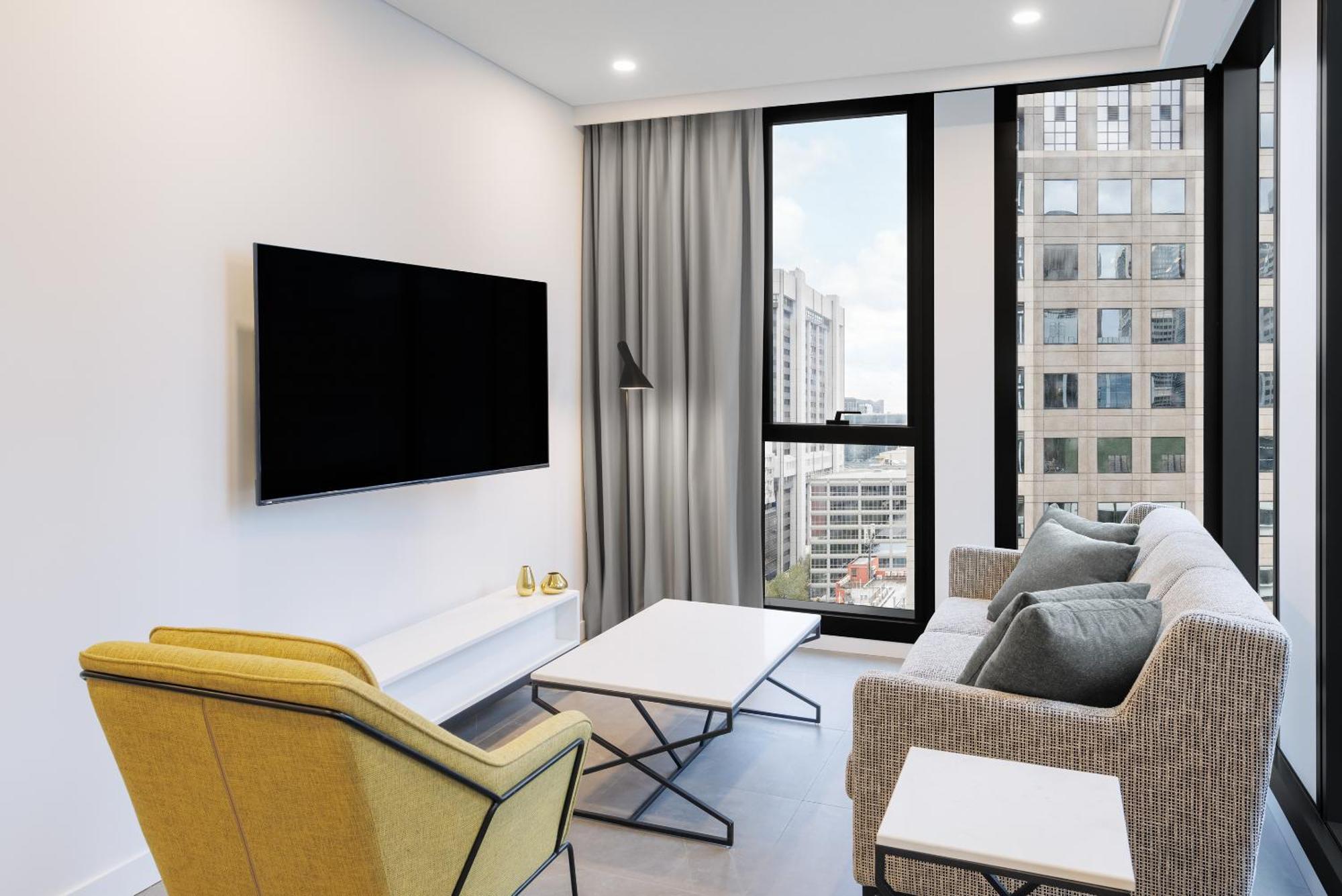 Meriton Suites Мельбурн Екстер'єр фото A living room
